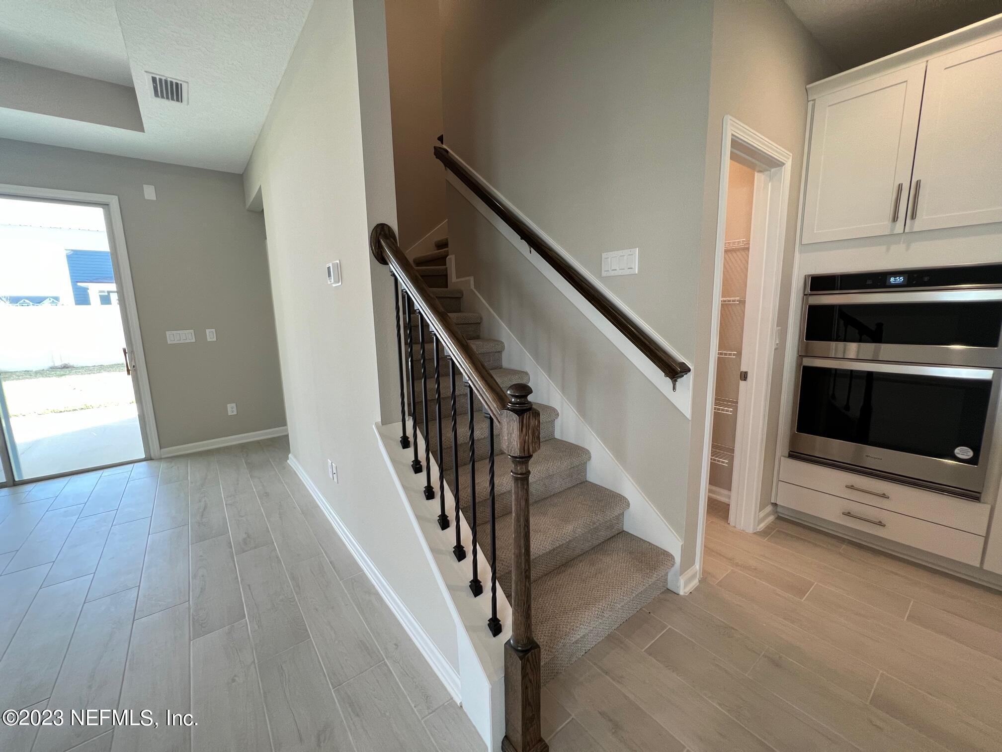 63 Yardley Ct Street St. Augustine, FL 32092 - Photo 8 of 54 a view of entryway and hall with wooden floor