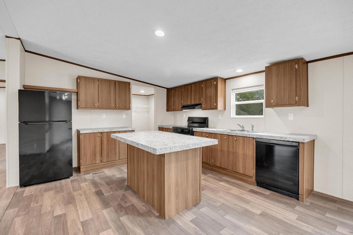 Tbd Overhill Road Bastrop, TX 78602 - Photo 16 of 37 a kitchen with a sink a microwave a refrigerator and cabinets