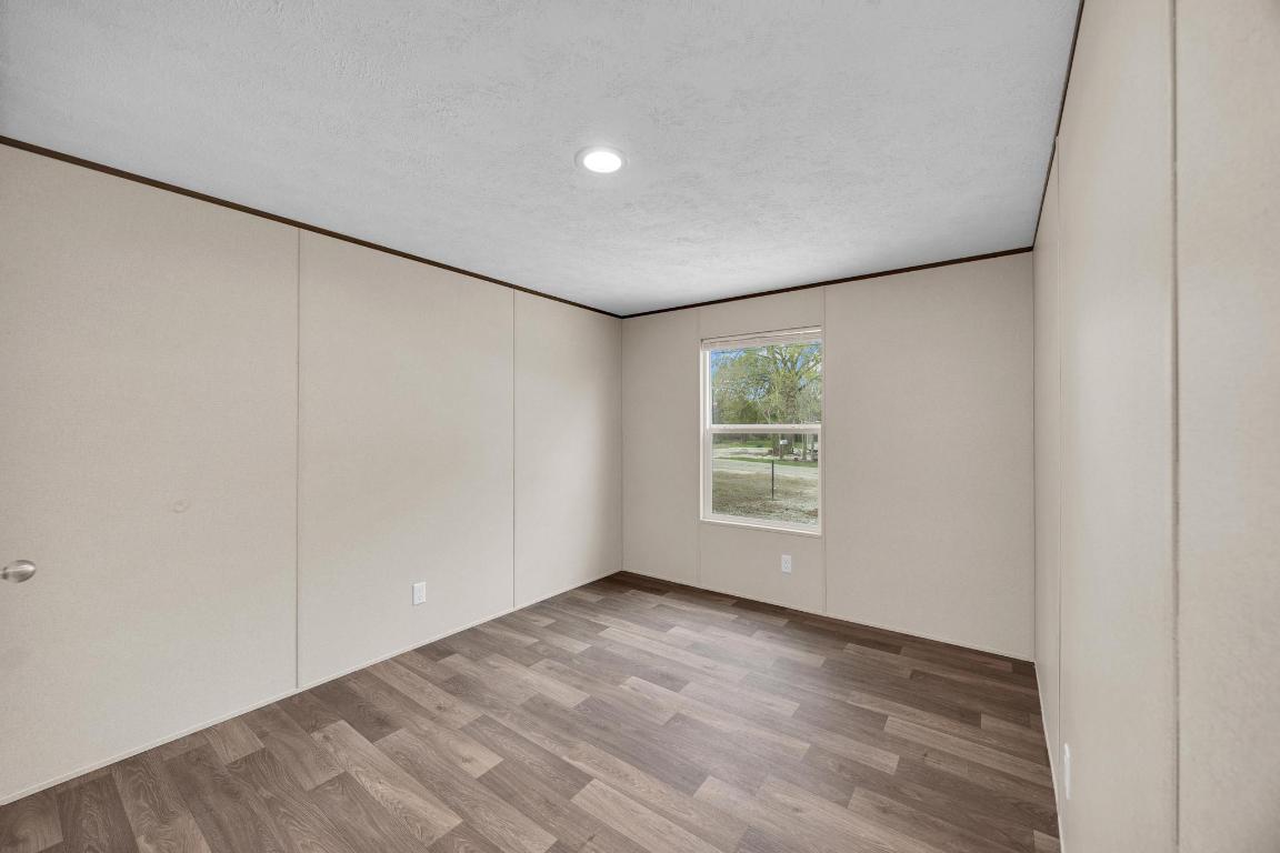 Tbd Overhill Road Bastrop, TX 78602 - Photo 24 of 37 wooden floor in an empty room with a window