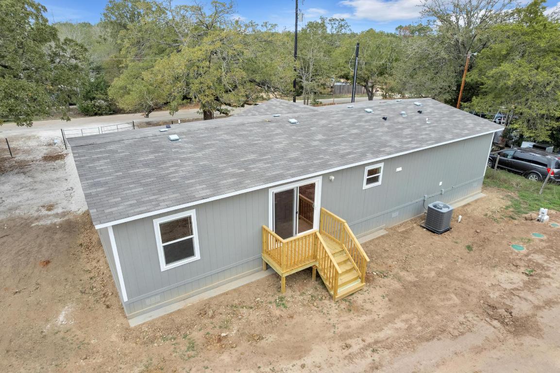 Tbd Overhill Road Bastrop, TX 78602 - Photo 33 of 37 a backyard of a house with table and chairs