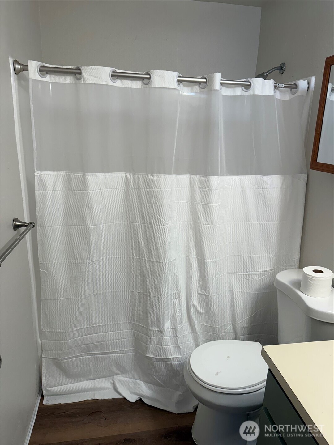 1111 West Market Street Aberdeen, WA 98520 - Photo 15 of 40 a white toilet sitting next to a shower