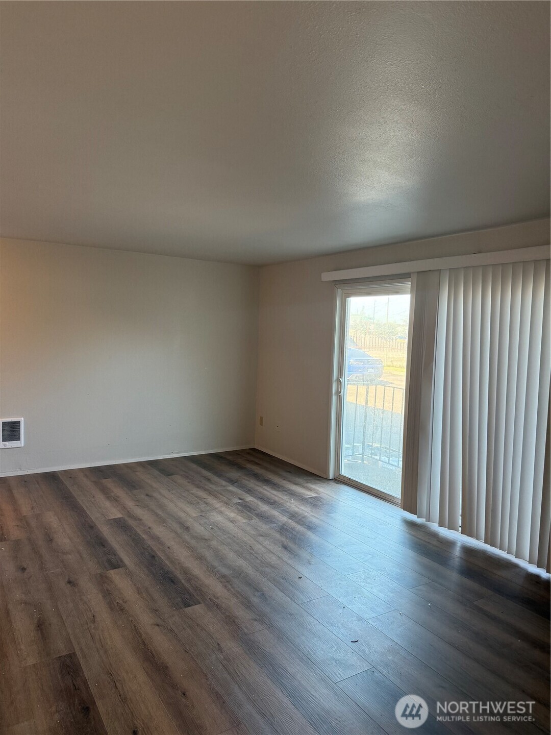 1111 West Market Street Aberdeen, WA 98520 - Photo 16 of 40 an empty room with wooden floor and windows