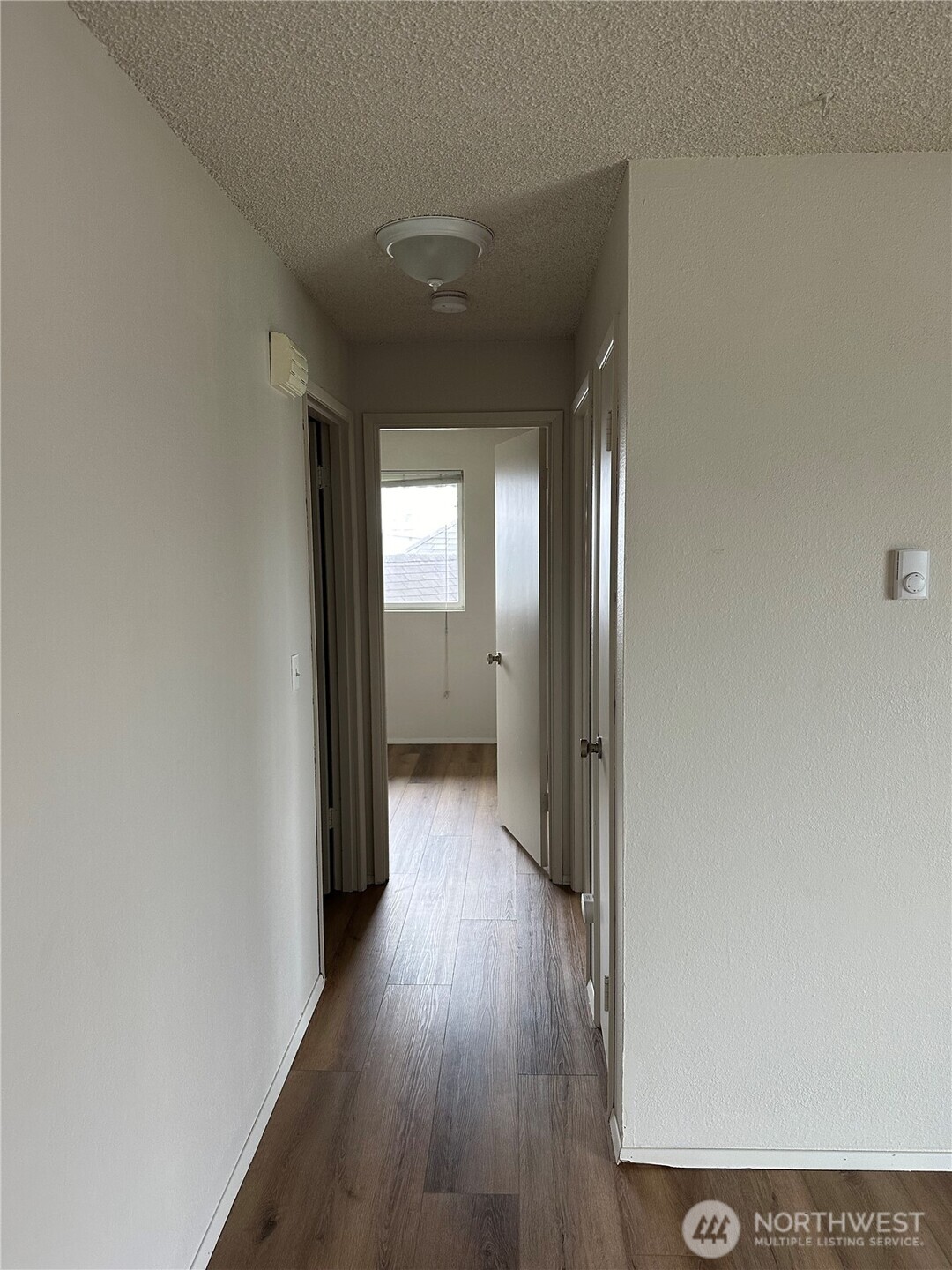1111 West Market Street Aberdeen, WA 98520 - Photo 6 of 40 a view of hallway with wooden floor