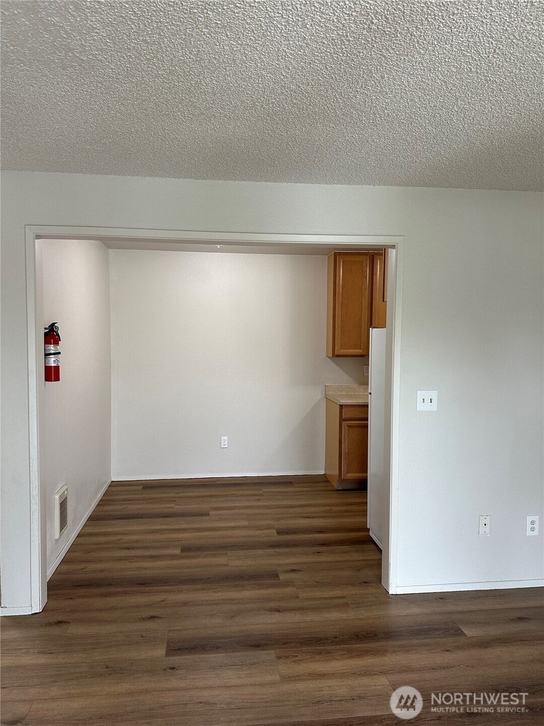 1111 West Market Street Aberdeen, WA 98520 - Photo 8 of 40 a view of a hallway with wooden floor and entryway