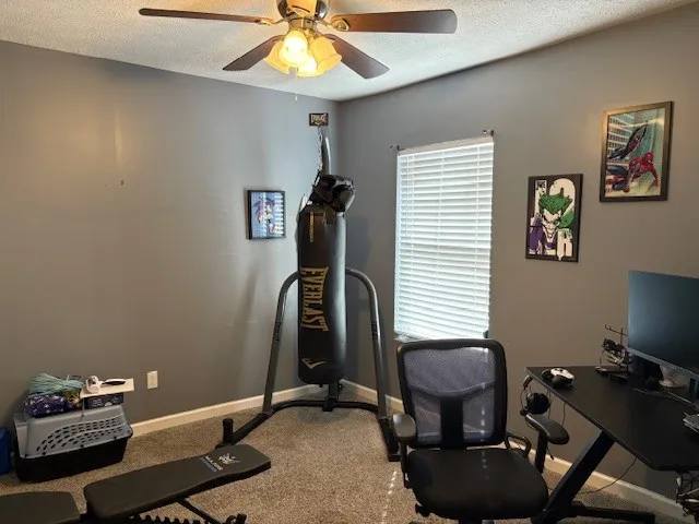a room with gym equipment and a window
