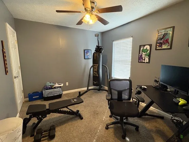a room with gym equipment and a window