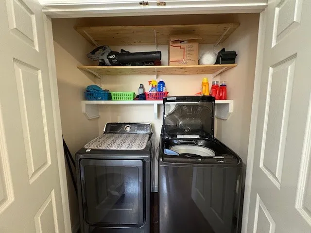 a utility room with dryer and washer