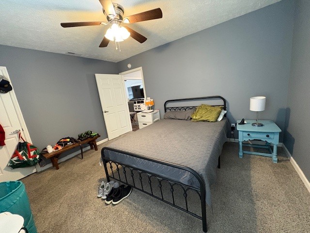 125 McGinness Avenue Carthage, TN 37030 - Photo 9 of 28 a bedroom with a bed and a chandelier