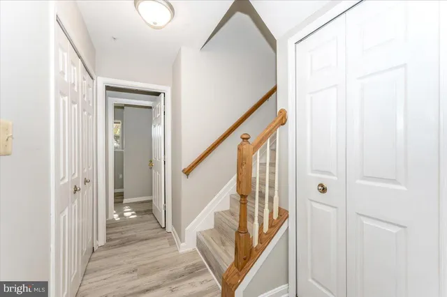 a view of an entryway with wooden floor