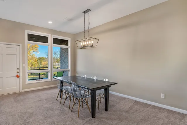 a kitchen with granite countertop a sink stainless steel appliances and cabinets