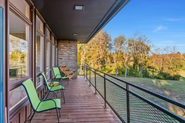 a kitchen with granite countertop stainless steel appliances and wooden cabinets