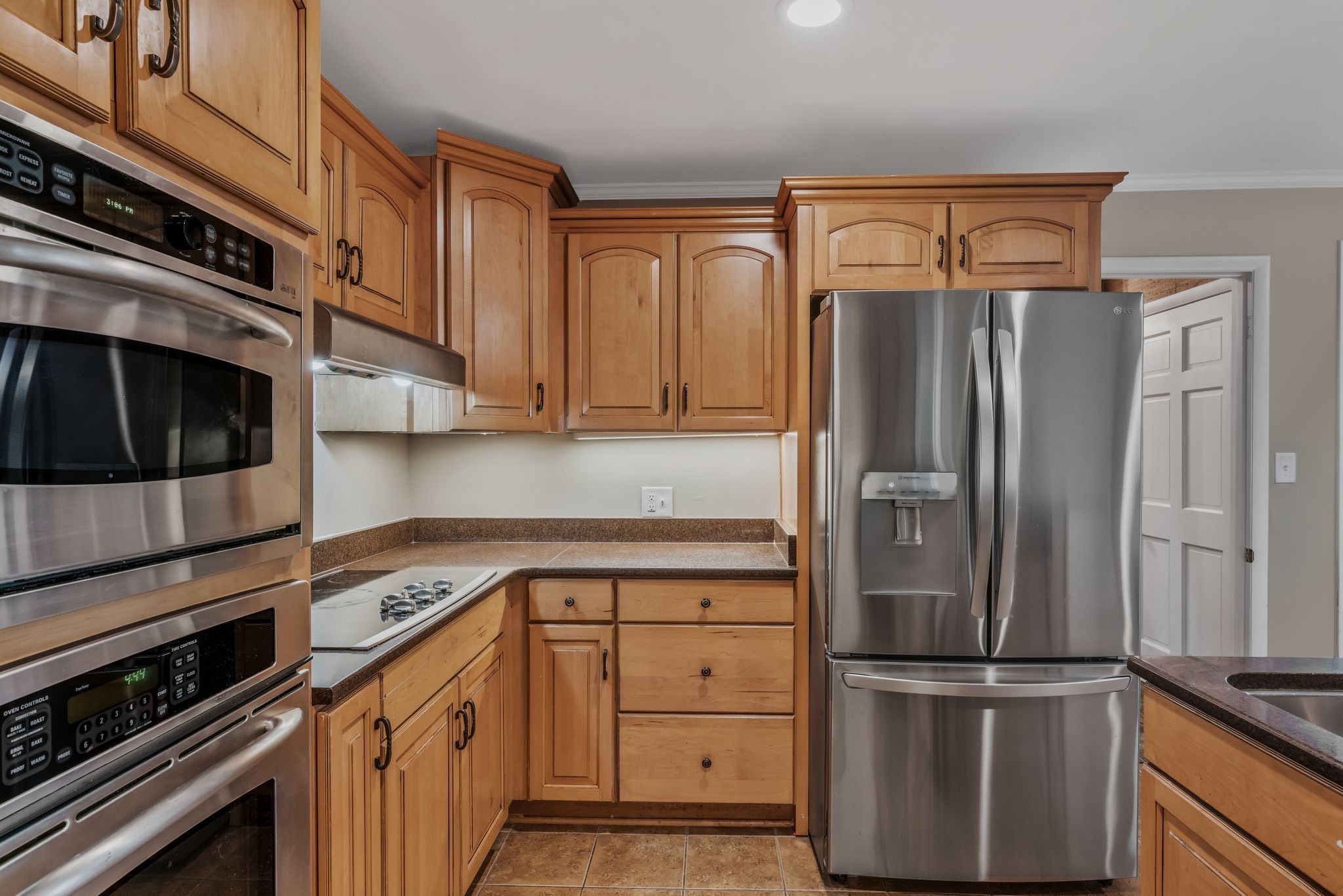 4 Hidden Acres Lebanon, TN 37087 - Photo 17 of 77 a kitchen with granite countertop stainless steel appliances and wooden cabinets