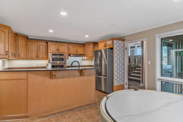 a bathroom with a sink and mirror with painted walls