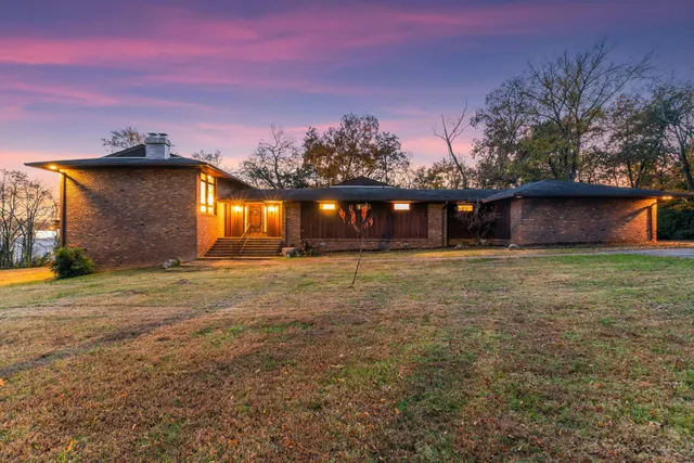 a front view of house with yard and seating space
