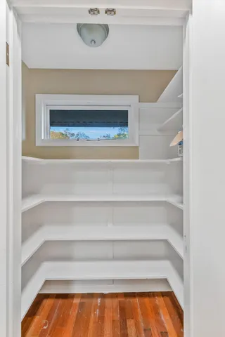 a bed sitting in a room next to a window