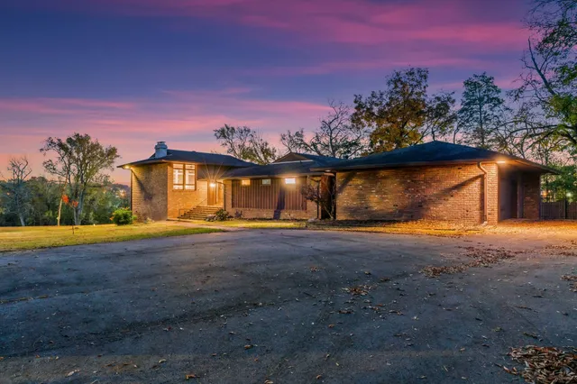 a view of a livingroom with furniture and staircase