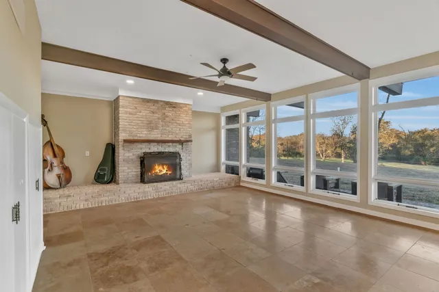 a view of a room with wooden floor and window