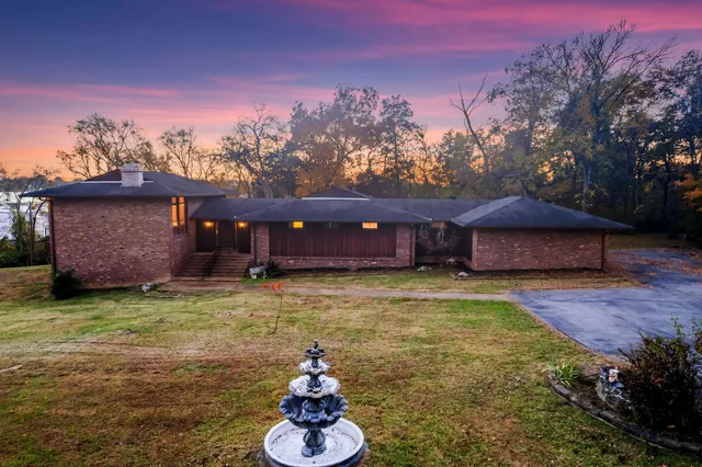 a view of swimming pool with a patio
