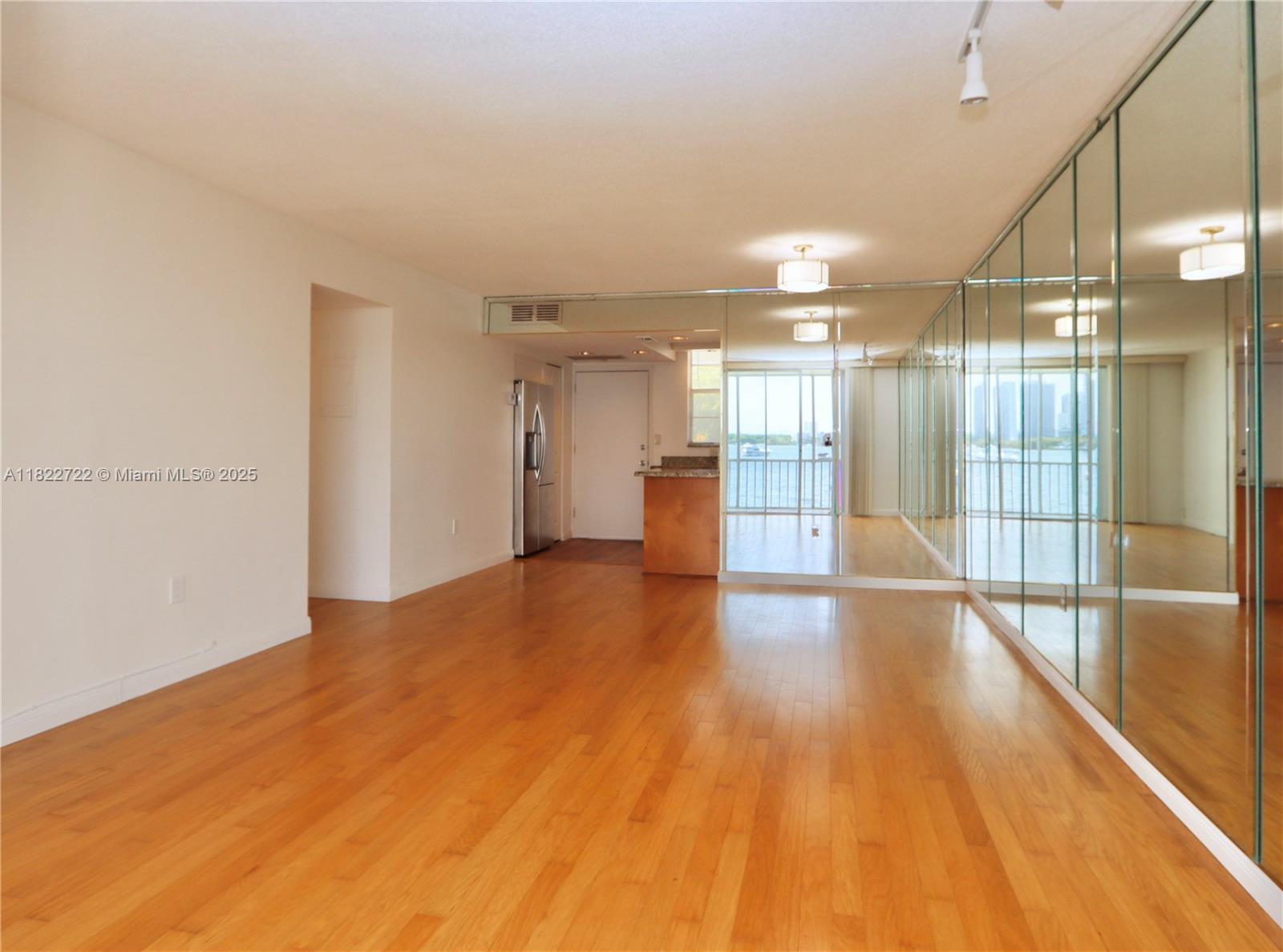 2920 Point E Drive, Unit N208 Aventura, FL 33160 - Photo 11 of 34 a view of empty room with wooden floor