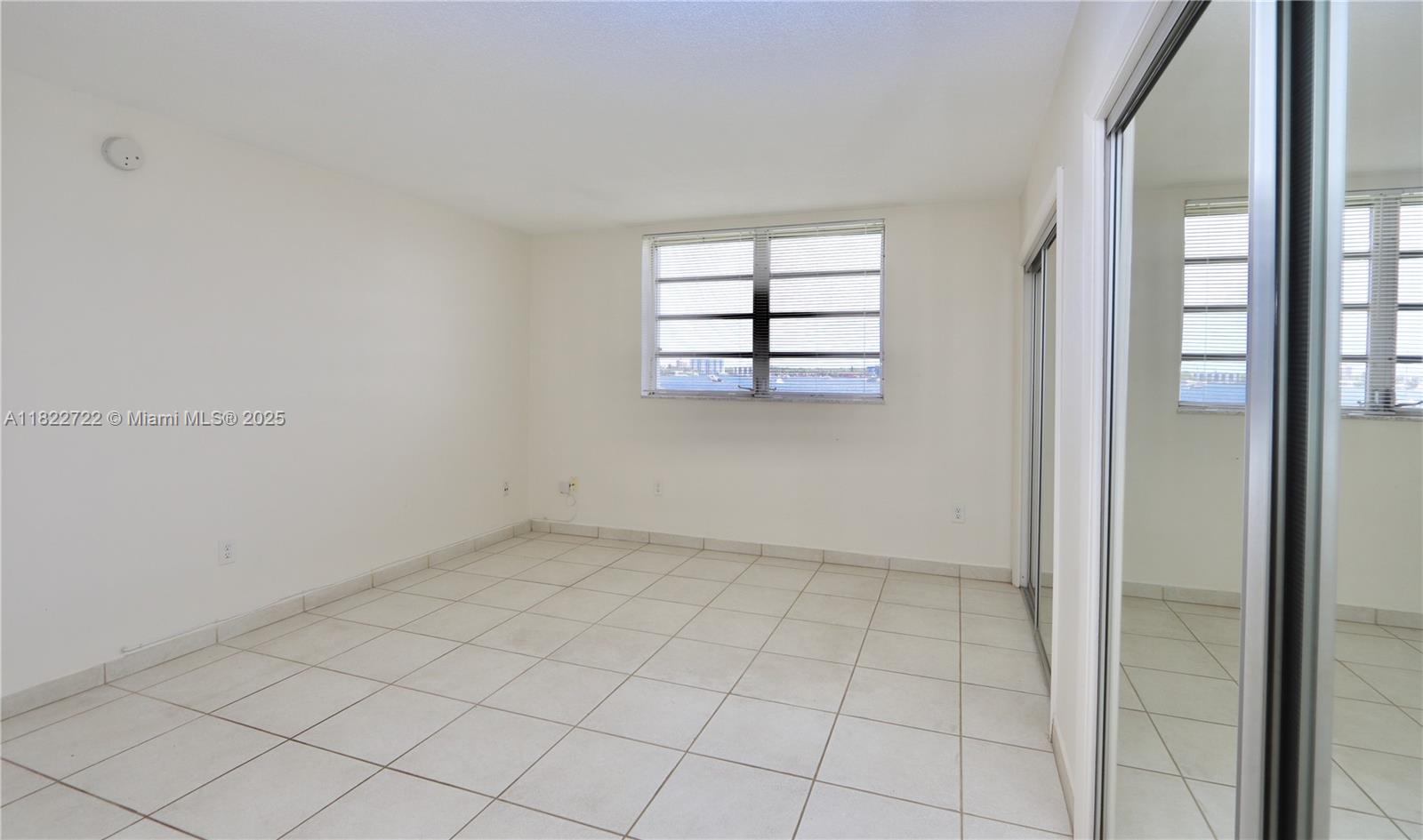 2920 Point E Drive, Unit N208 Aventura, FL 33160 - Photo 13 of 34 an empty room with windows