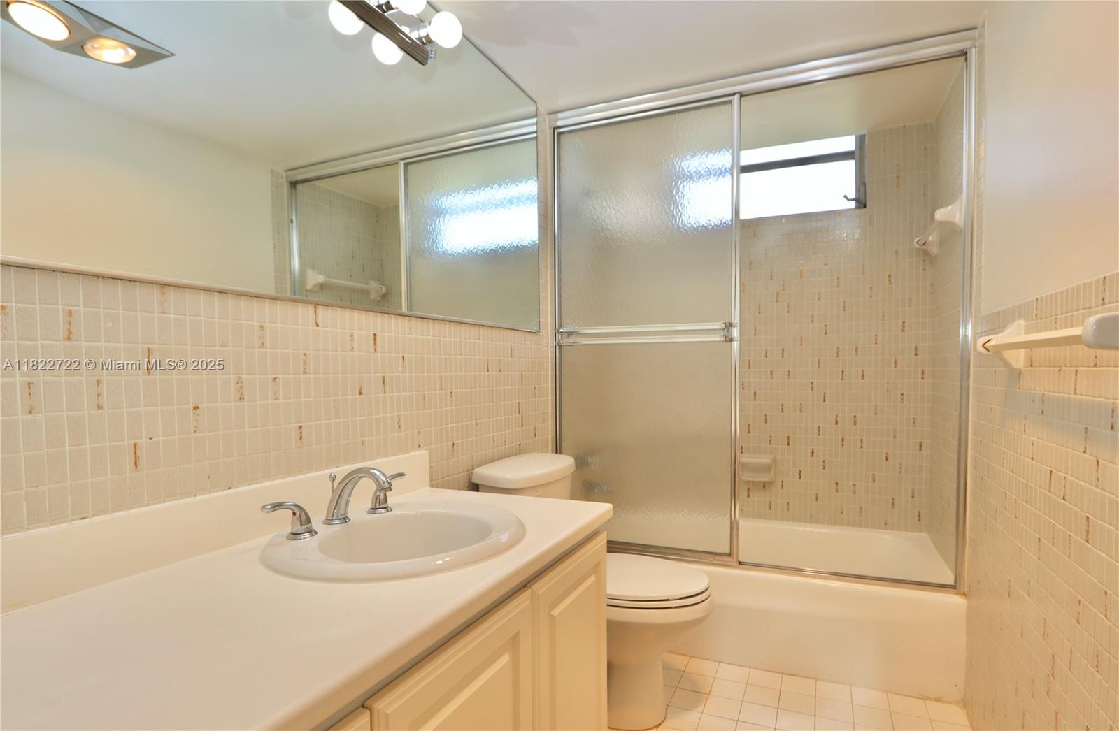 2920 Point E Drive, Unit N208 Aventura, FL 33160 - Photo 18 of 34 a bathroom with a sink toilet and shower