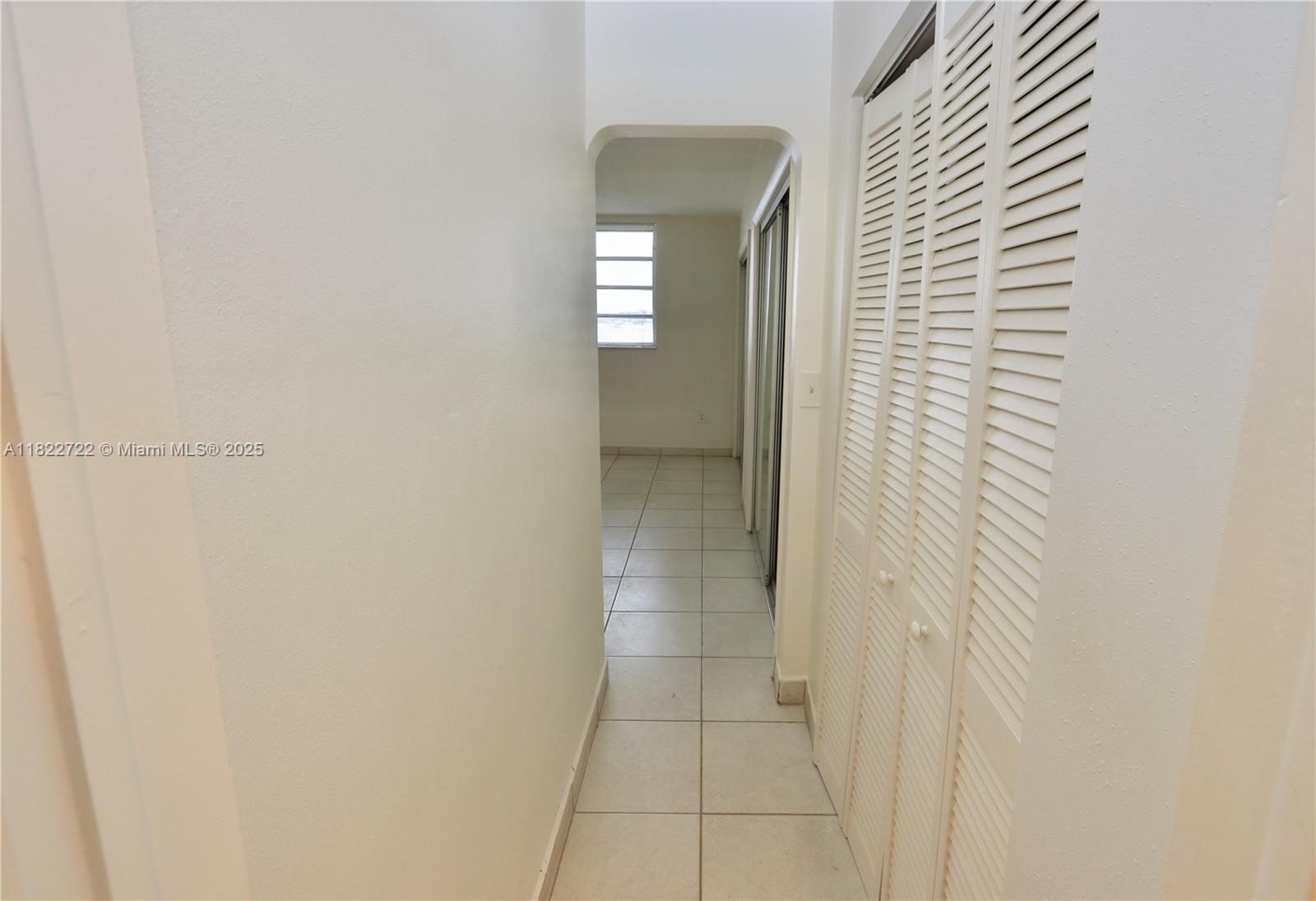 2920 Point E Drive, Unit N208 Aventura, FL 33160 - Photo 19 of 34 a view of a bathroom from a hallway