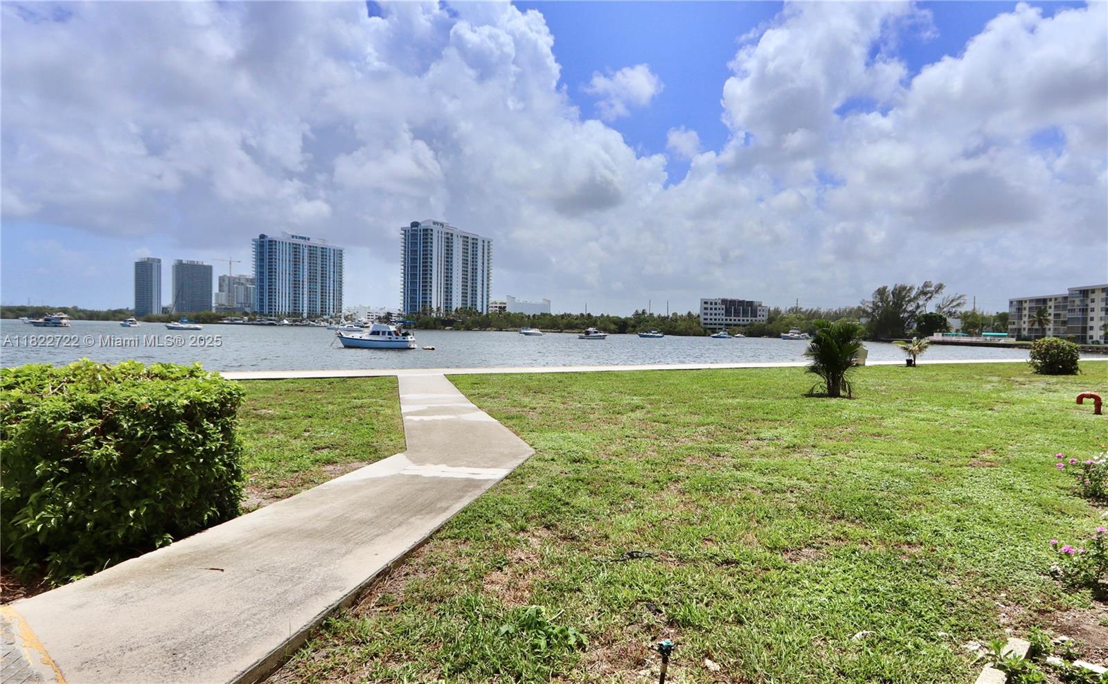 2920 Point E Drive, Unit N208 Aventura, FL 33160 - Photo 28 of 34 a view of a fountain in front of a building