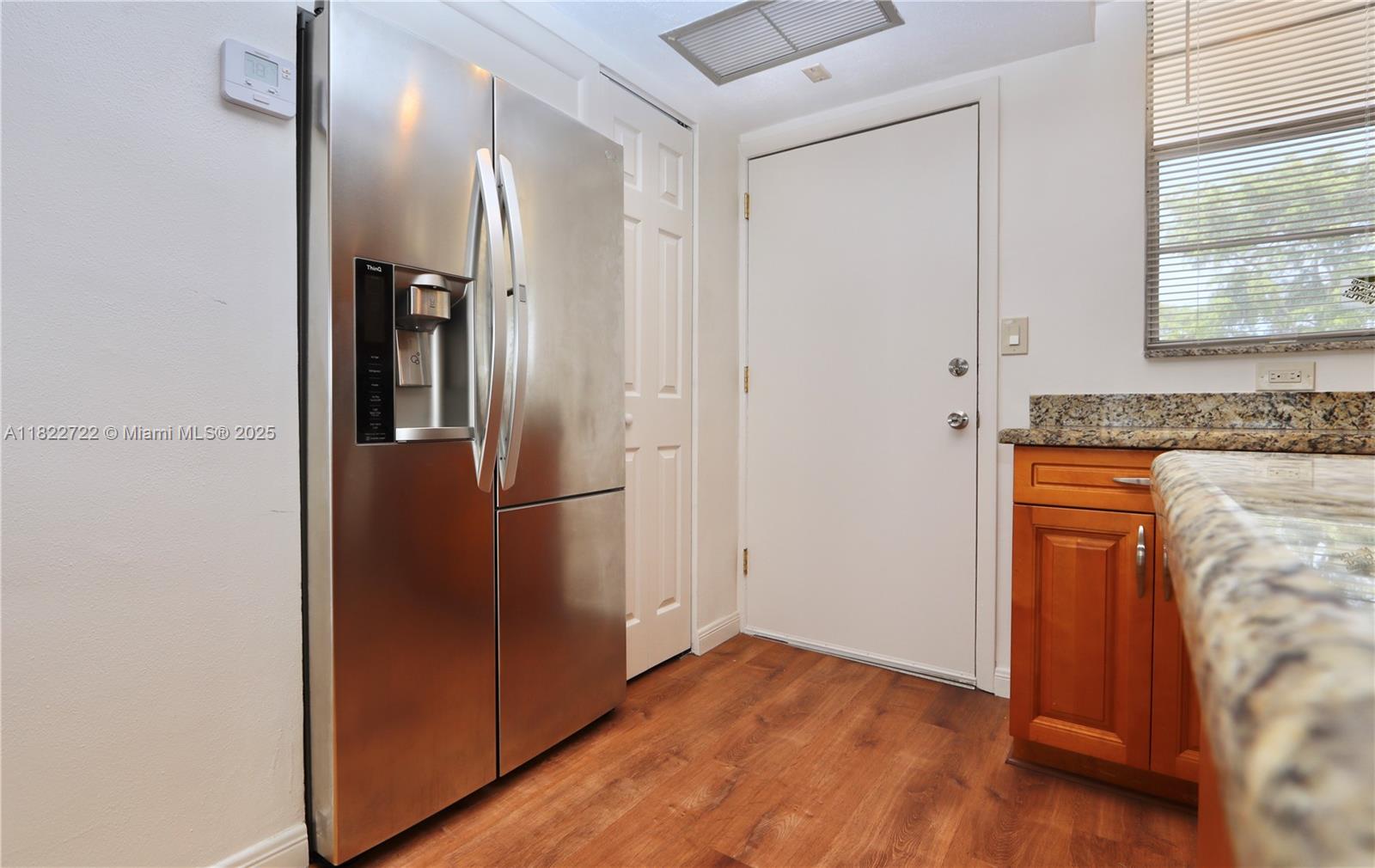 2920 Point E Drive, Unit N208 Aventura, FL 33160 - Photo 9 of 34 an empty room with wooden floor and a window