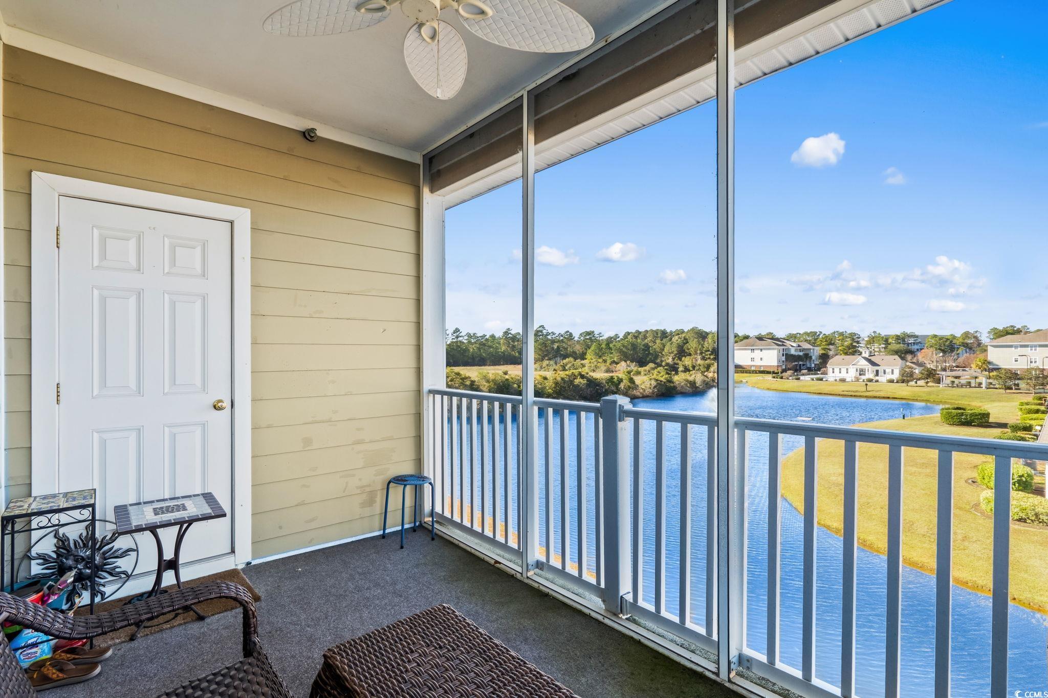 336 Kiskadee Loop, Unit 19O Conway, SC 29526 - Photo 24 of 26 Sunroom / solarium featuring a water view, a ceiling fan, and a balcony