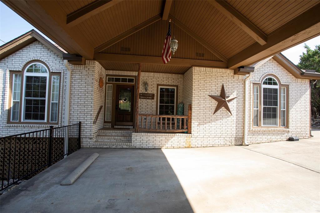 880 Cliffs Drive Graford, TX 76449 - Photo 1 of 40 a house view with a outdoor space