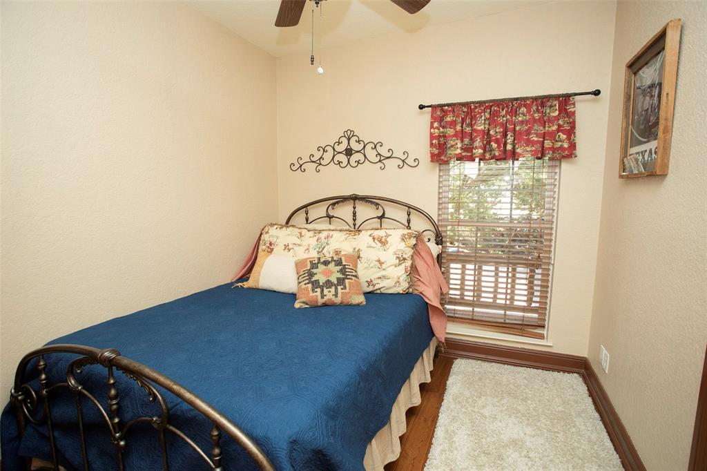 880 Cliffs Drive Graford, TX 76449 - Photo 14 of 40 a view of a bedroom with a bed