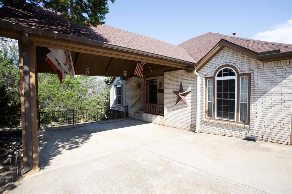 880 Cliffs Drive Graford, TX 76449 - Photo 2 of 40 a view of a house with a porch