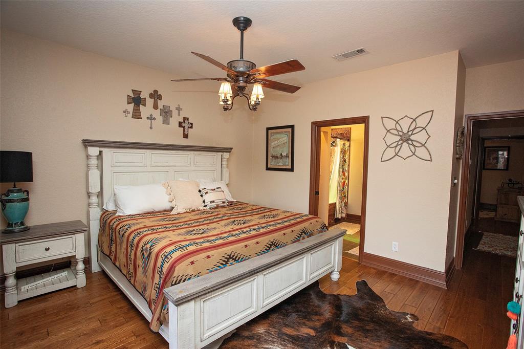 880 Cliffs Drive Graford, TX 76449 - Photo 23 of 40 a bedroom with bed and window