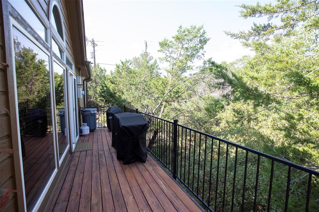 880 Cliffs Drive Graford, TX 76449 - Photo 32 of 40 a view of a balcony with wooden floor