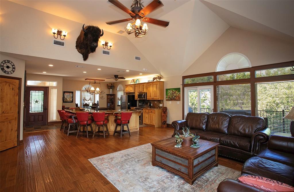 880 Cliffs Drive Graford, TX 76449 - Photo 5 of 40 a living room with furniture a flat screen tv and a large window
