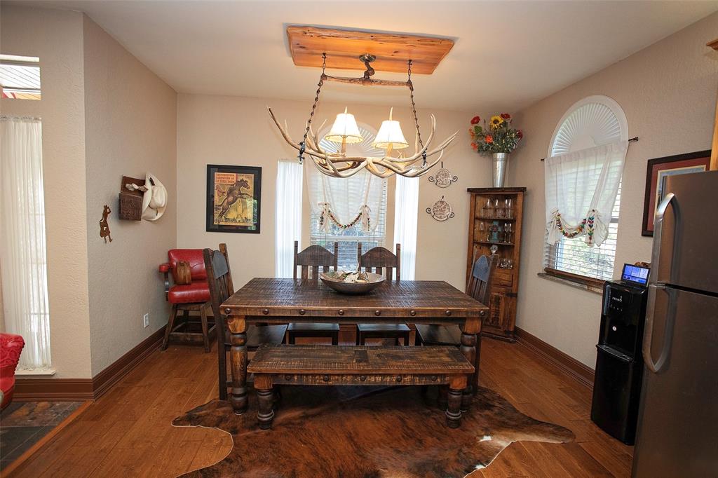 880 Cliffs Drive Graford, TX 76449 - Photo 8 of 40 a view of a dining room with furniture and wooden floor