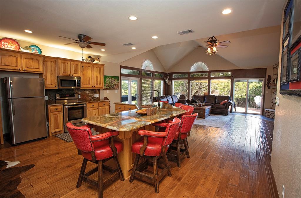 880 Cliffs Drive Graford, TX 76449 - Photo 9 of 40 a view of a dining room with furniture window and wooden floor