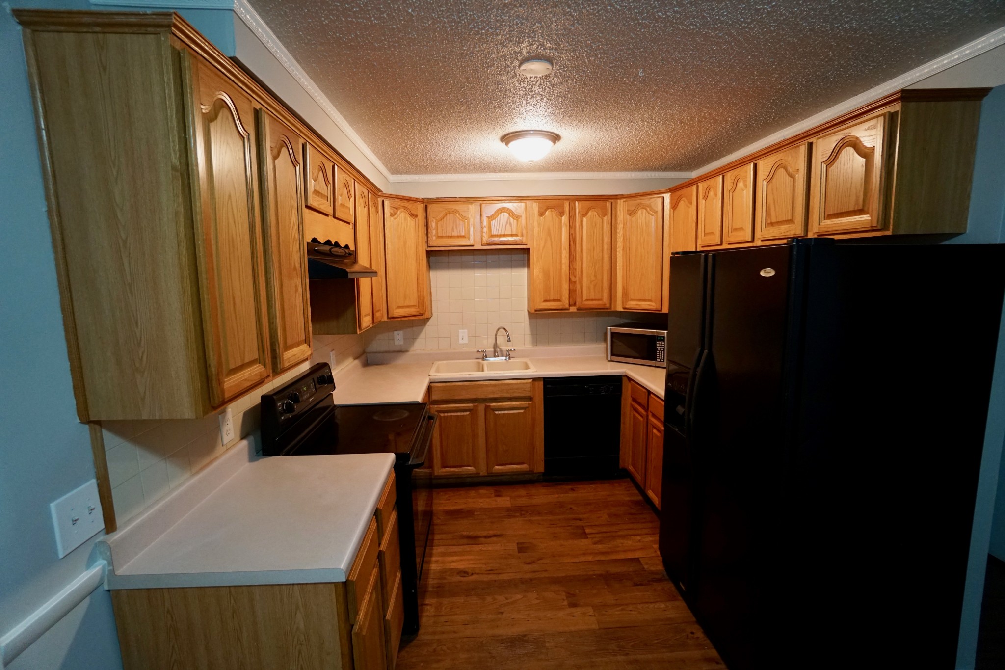 500 Paragon Mills Road, Unit B7 Nashville, TN 37211 - Photo 4 of 9 a kitchen with a refrigerator stove and sink