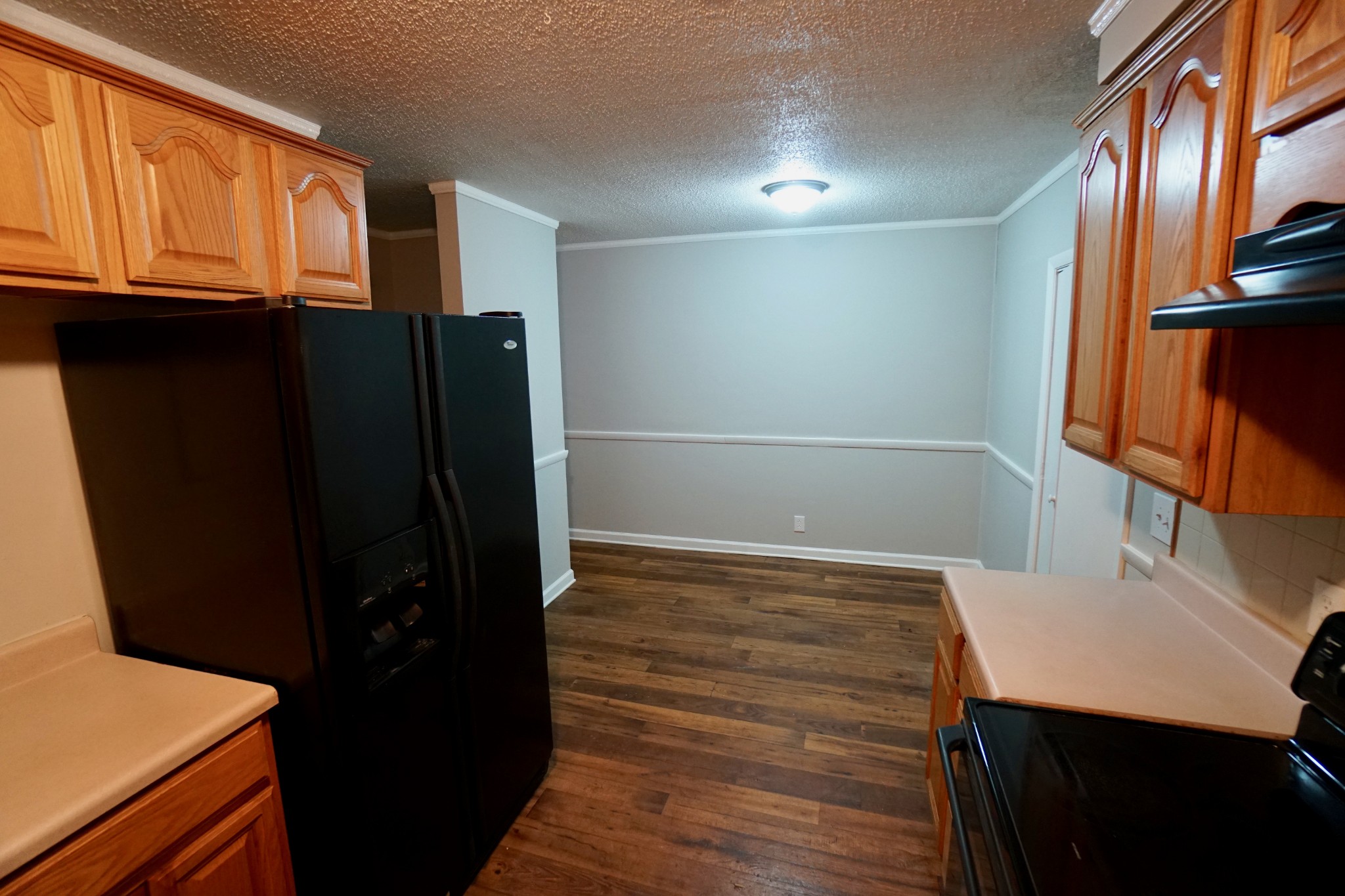 500 Paragon Mills Road, Unit B7 Nashville, TN 37211 - Photo 5 of 9 a view of walk in closet with wooden floor