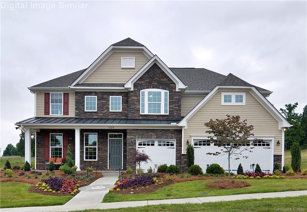 7123 Messina Road, Unit 130 Indian Land, SC 29707 - Photo 1 of 15 a front view of a house with a yard