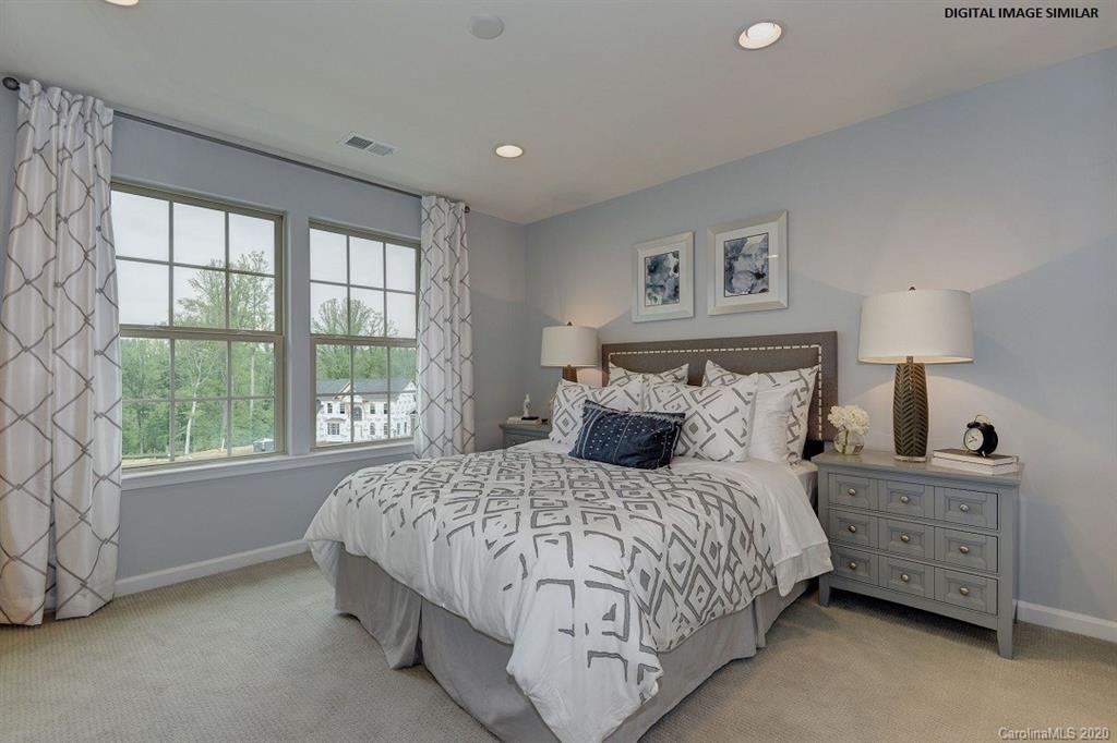 7123 Messina Road, Unit 130 Indian Land, SC 29707 - Photo 11 of 15 a bedroom with a bed dresser and a window