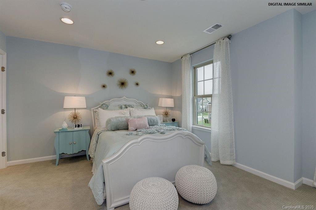 7123 Messina Road, Unit 130 Indian Land, SC 29707 - Photo 12 of 15 a bed room with a bed and a window