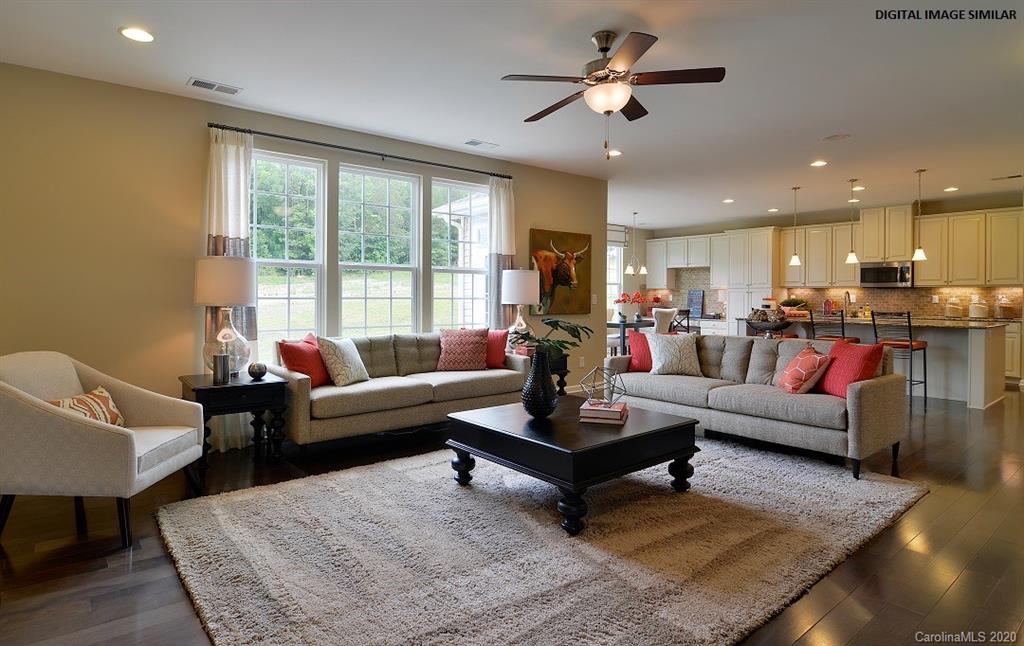 7123 Messina Road, Unit 130 Indian Land, SC 29707 - Photo 4 of 15 a living room with furniture and a large window