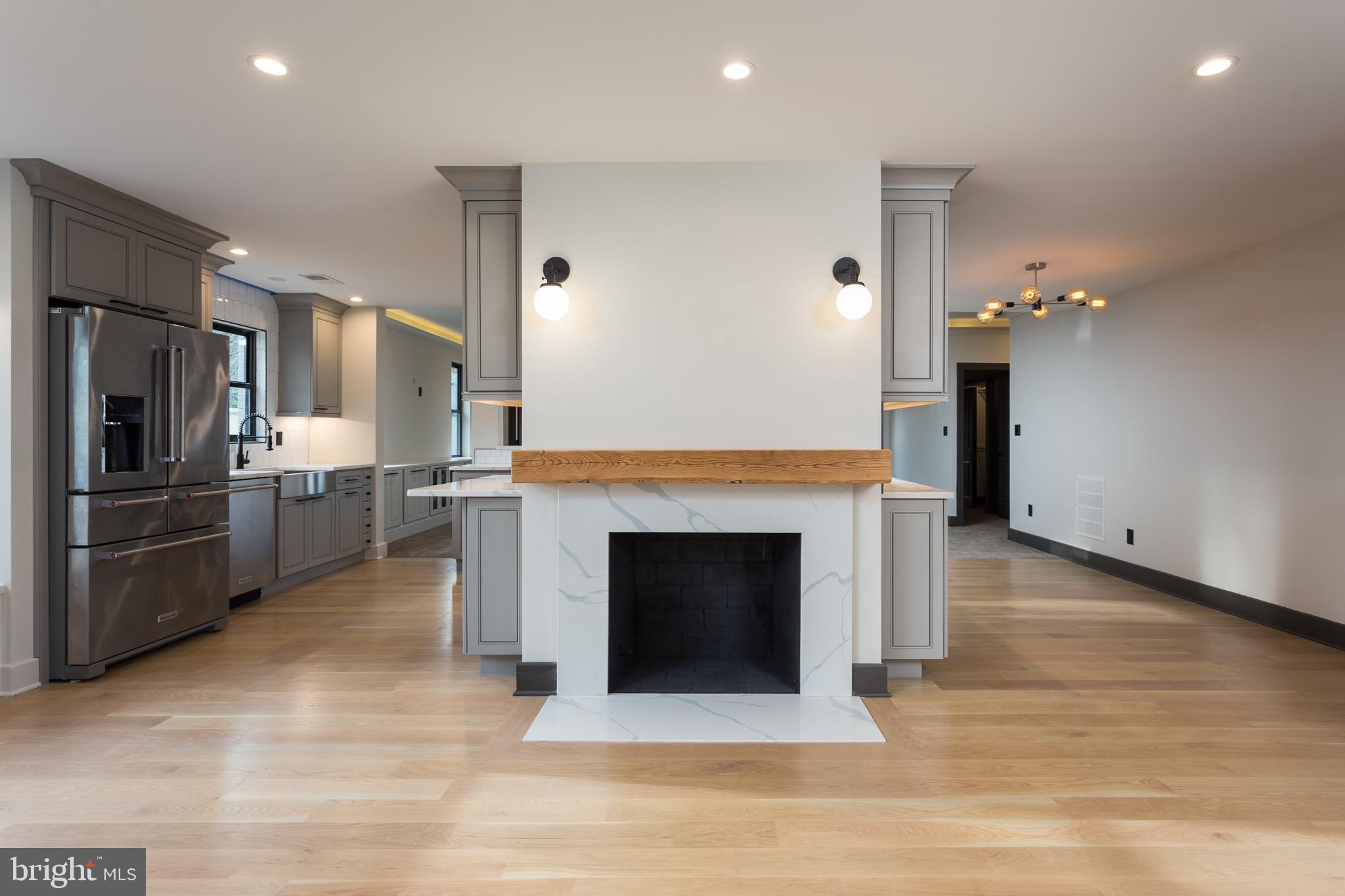 1610 Baltimore Road Alexandria, VA 22308 - Photo 12 of 45 Modern kitchen with elegant fireplace feature.
