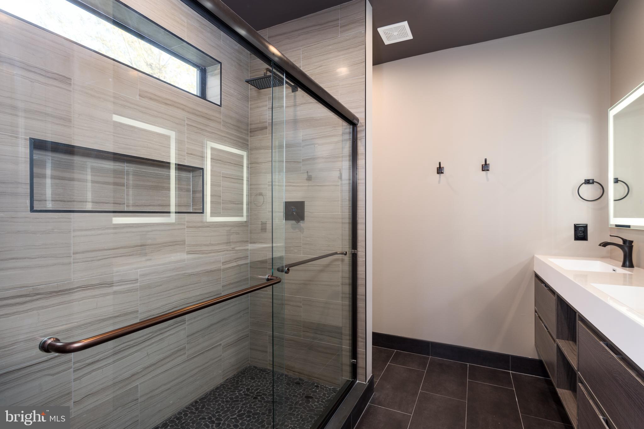1610 Baltimore Road Alexandria, VA 22308 - Photo 36 of 45 Sleek modern bathroom with elegant finishes.