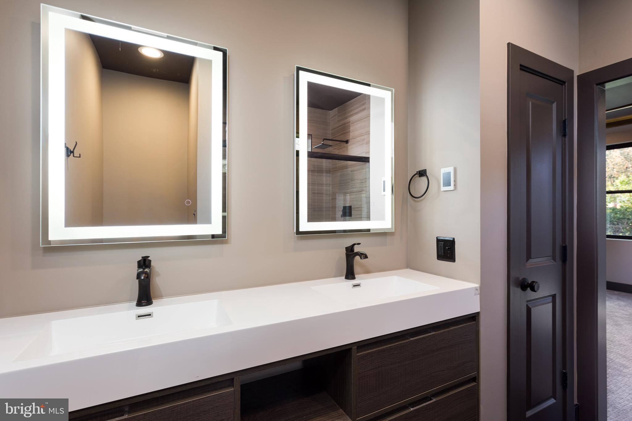 1610 Baltimore Road Alexandria, VA 22308 - Photo 37 of 45 Sleek modern bathroom with dual mirrors.