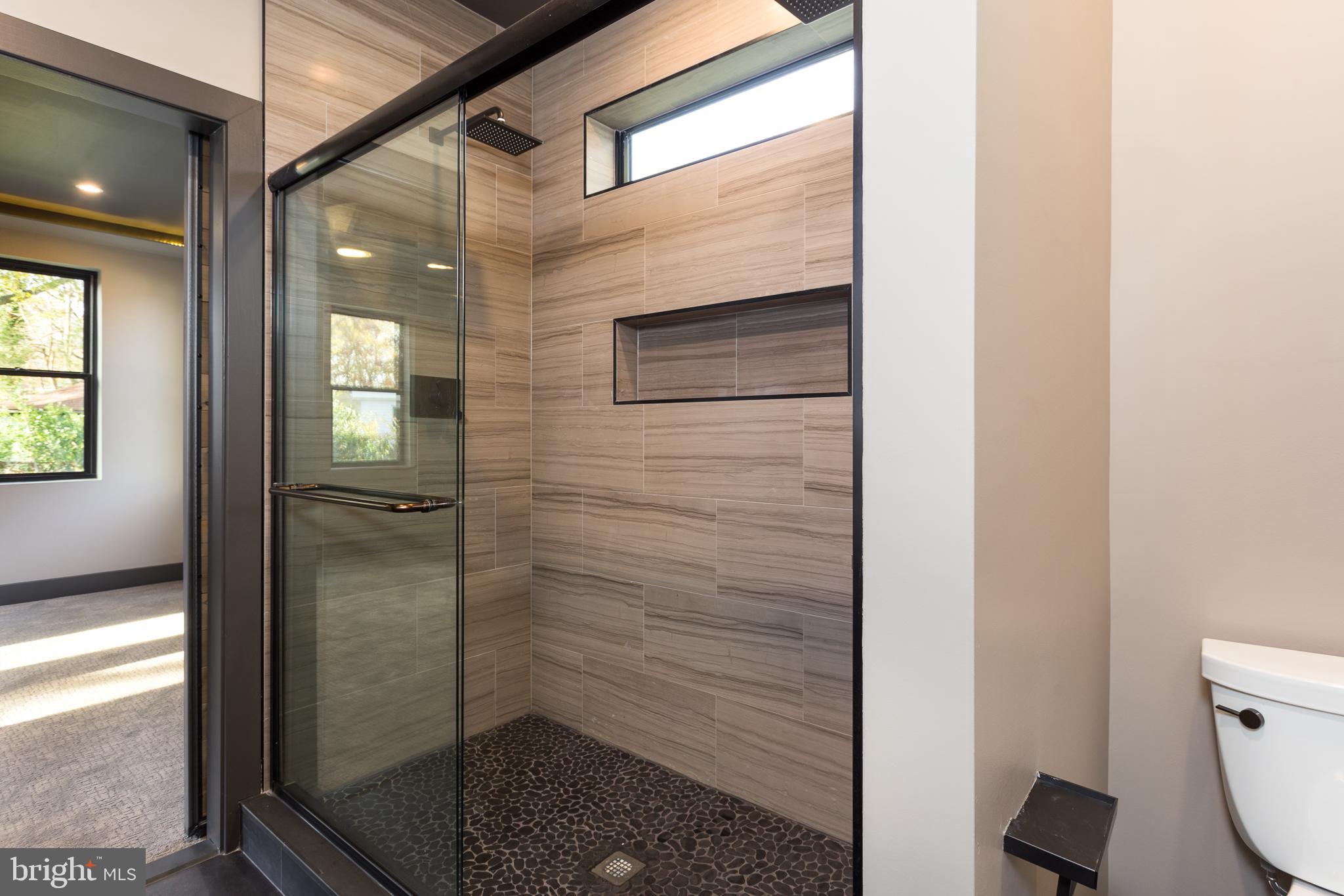 1610 Baltimore Road Alexandria, VA 22308 - Photo 38 of 45 Sleek modern shower with elegant finishes.