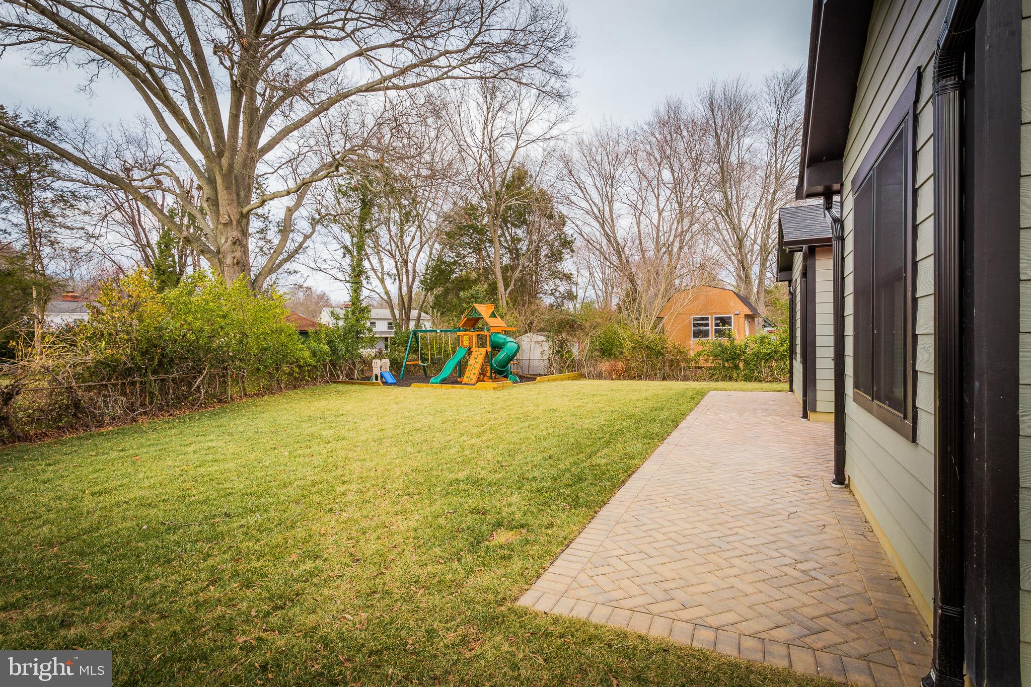 1610 Baltimore Road Alexandria, VA 22308 - Photo 44 of 45 Spacious backyard with playset and greenery.