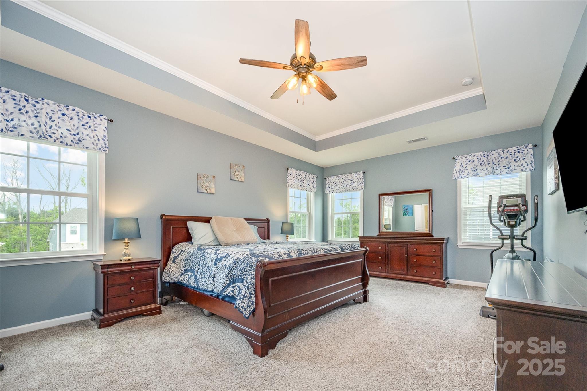 2960 Haley Circle Davidson, NC 28036 - Photo 15 of 31 a bedroom with a bed and a chandelier