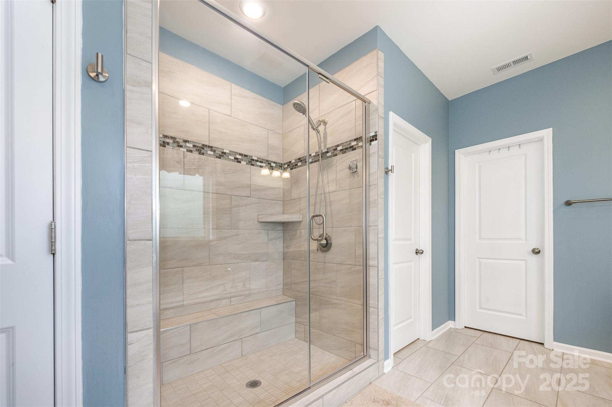 2960 Haley Circle Davidson, NC 28036 - Photo 17 of 31 a bathroom with a glass shower door